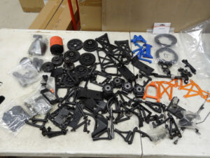 Used Rovan KM Baja 5B 5T plastic parts, clutch bells, spur gears, a few metal parts, all used/scratched