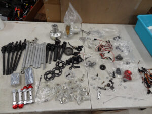Used Primal RC V1-2 Raminator parts, have scratches, axle needs repairs