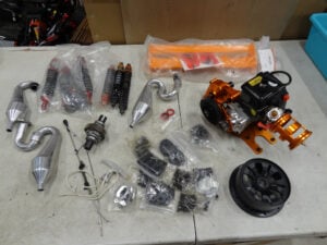 Used Rovan KM Baja 5B parts lot, nice engine with CNC gearbox, 30.5cc, cranks, unknown condition, all parts used, nice shocks!