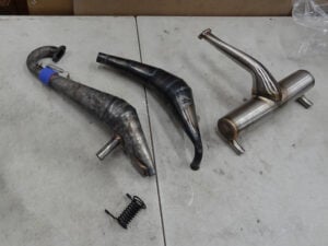 2 USED Bartolone pipes for Rovan LT, LOSI 5ive-T and Baja, all used, and Primal RC Challenger pipe