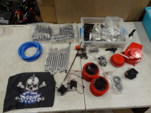 Used Random Primal RC Monster Truck Parts, (2) servos, pull starts, air filters, body mounts, hardware, etc...