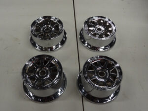 Set of 4, baja rims front and rear, chrome plastic, one rim discolored on inside