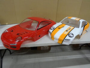 1/5 scale car body for Rovan Baja FC, 2x lexan, red and white/orange, used, scratch + dent